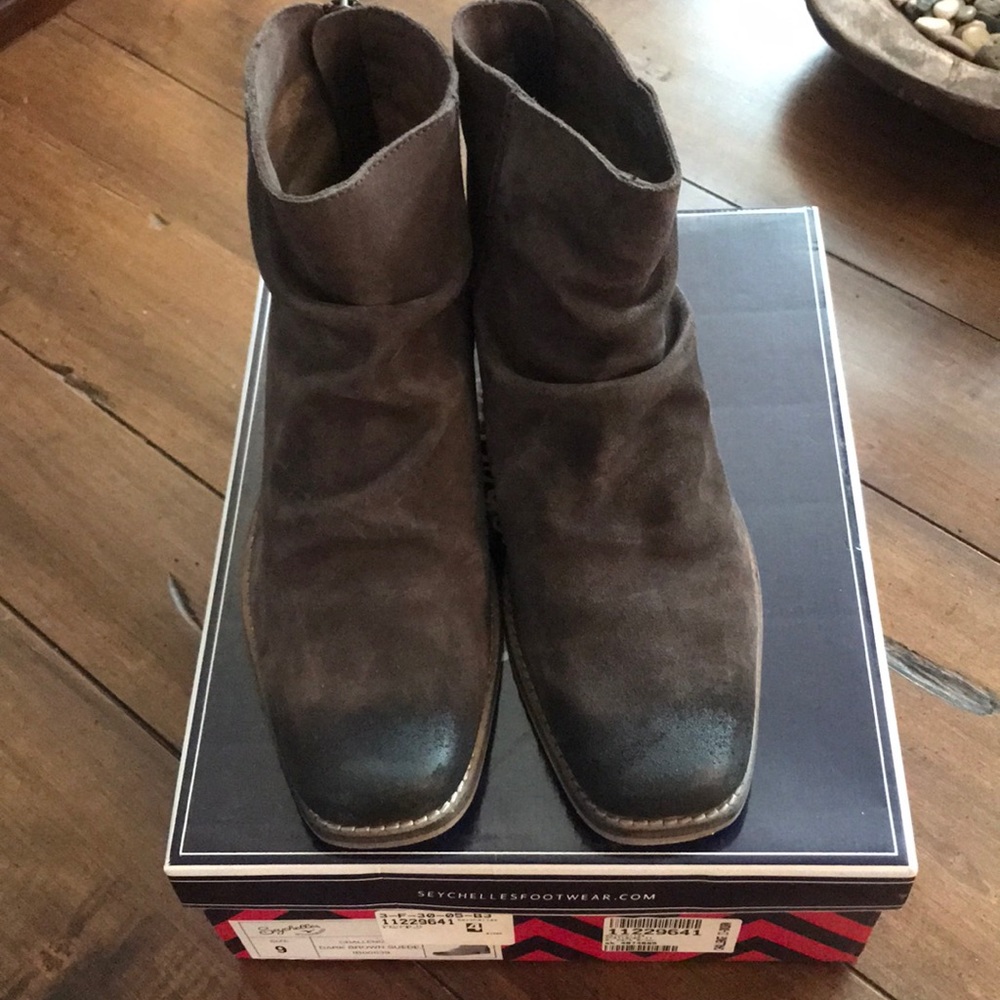 Brown suede distressed booties.